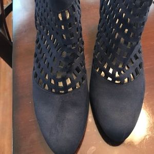 Blue suede 2 inch heels w laser cutouts.